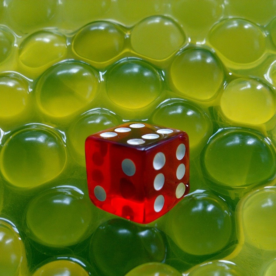 red dice among hydrogel balls