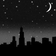 Night starry sky over dark silhouette of the city