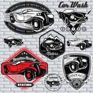 set of emblems with retro car on wall