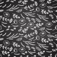 Herbal pattern on a background of black slate