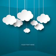 White clouds hand from strings on blue background N2