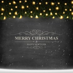 Merry Christmas lettering on Chalkboard with bright garland and snow