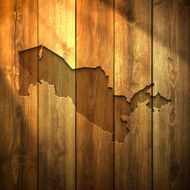 Uzbekistan Map on lit Wooden Background