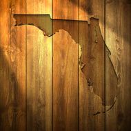 Florida Map on lit Wooden Background