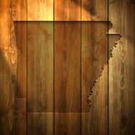 Arkansas Map on lit Wooden Background