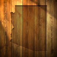 Arizona Map on lit Wooden Background