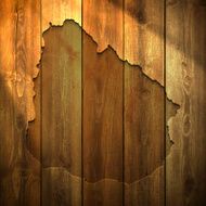 Uruguay Map on lit Wooden Background