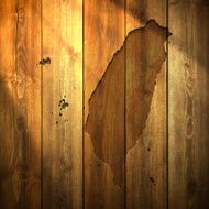 Taiwan Map on lit Wooden Background