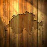 Switzerland Map on lit Wooden Background