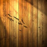 Solomon Islands Map on lit Wooden Background