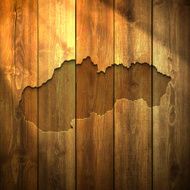 Slovakia Map on lit Wooden Background