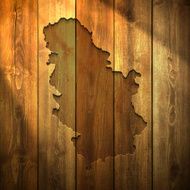 Serbia Map on lit Wooden Background