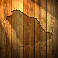 Saudi Arabia Map on lit Wooden Background
