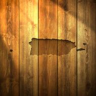 Puerto Map Rico on lit Wooden Background