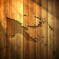 Papua New Guinea Map on lit Wooden Background