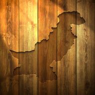 Pakistan Map on lit Wooden Background