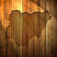 Nigeria Map on lit Wooden Background