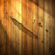 New Caledonia Map on lit Wooden Background