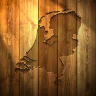 Netherlands Map on lit Wooden Background