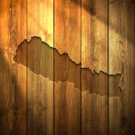Nepal Map on lit Wooden Background