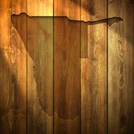 Namibia Map on lit Wooden Background
