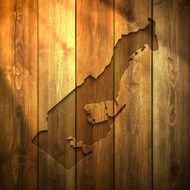 Monaco Map on lit Wooden Background