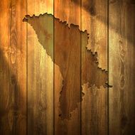 Moldova Map on lit Wooden Background