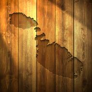 Malta Map on lit Wooden Background