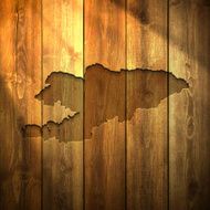 Kyrgyzstan Map on lit Wooden Background