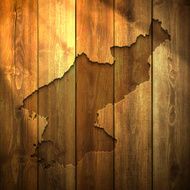 Korea North Map on lit Wooden Background