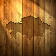 Kazakhstan Map on lit Wooden Background