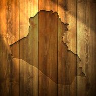 Iraq Map on lit Wooden Background