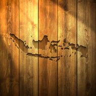 Indonesia Map on lit Wooden Background