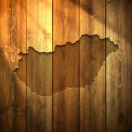 Hungary Map on lit Wooden Background