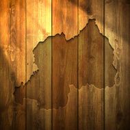 Rwanda Map on lit Wooden Background