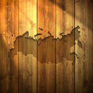 Russia Map on lit Wooden Background