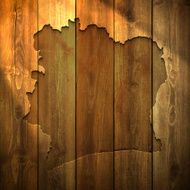 Ivory Coast Map on lit Wooden Background