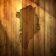 Greenland Map on lit Wooden Background
