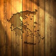 Greece Map on lit Wooden Background