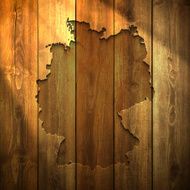 Germany Map on lit Wooden Background