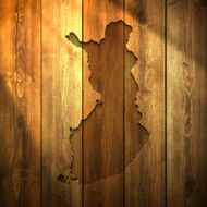 Finland Map on lit Wooden Background