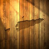 East Timor Map on lit Wooden Background