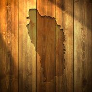 Dominica Map on lit Wooden Background