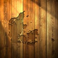 Denmark Map on lit Wooden Background