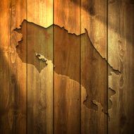 Costa Rica Map on lit Wooden Background