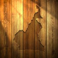 Cameroon Map on lit Wooden Background