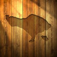 Bali Map on lit Wooden Background