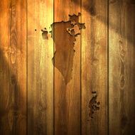 Bahrain Map on lit Wooden Background