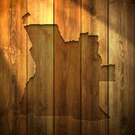 Angola Map on lit Wooden Background