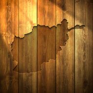 Afghanistan Map on lit Wooden Background